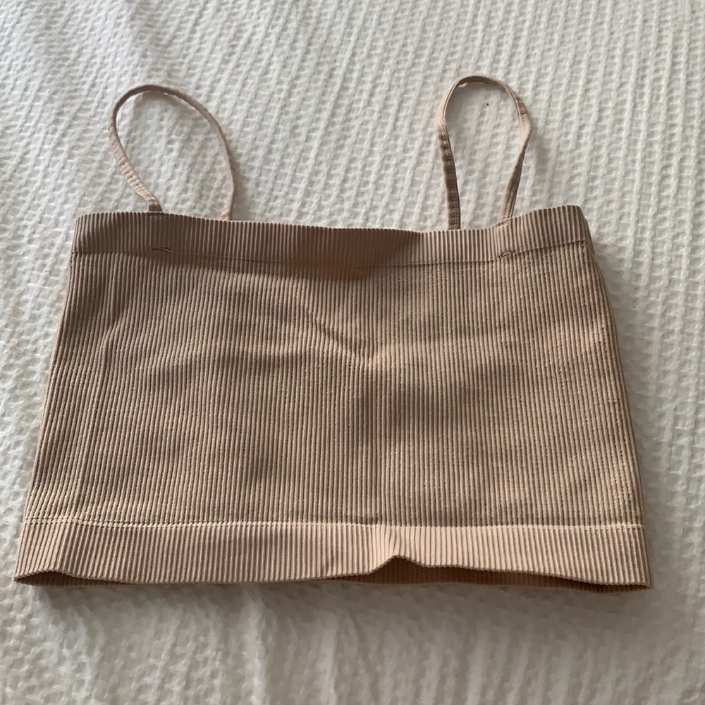 Beige tank top, fits very well, super cute with everything